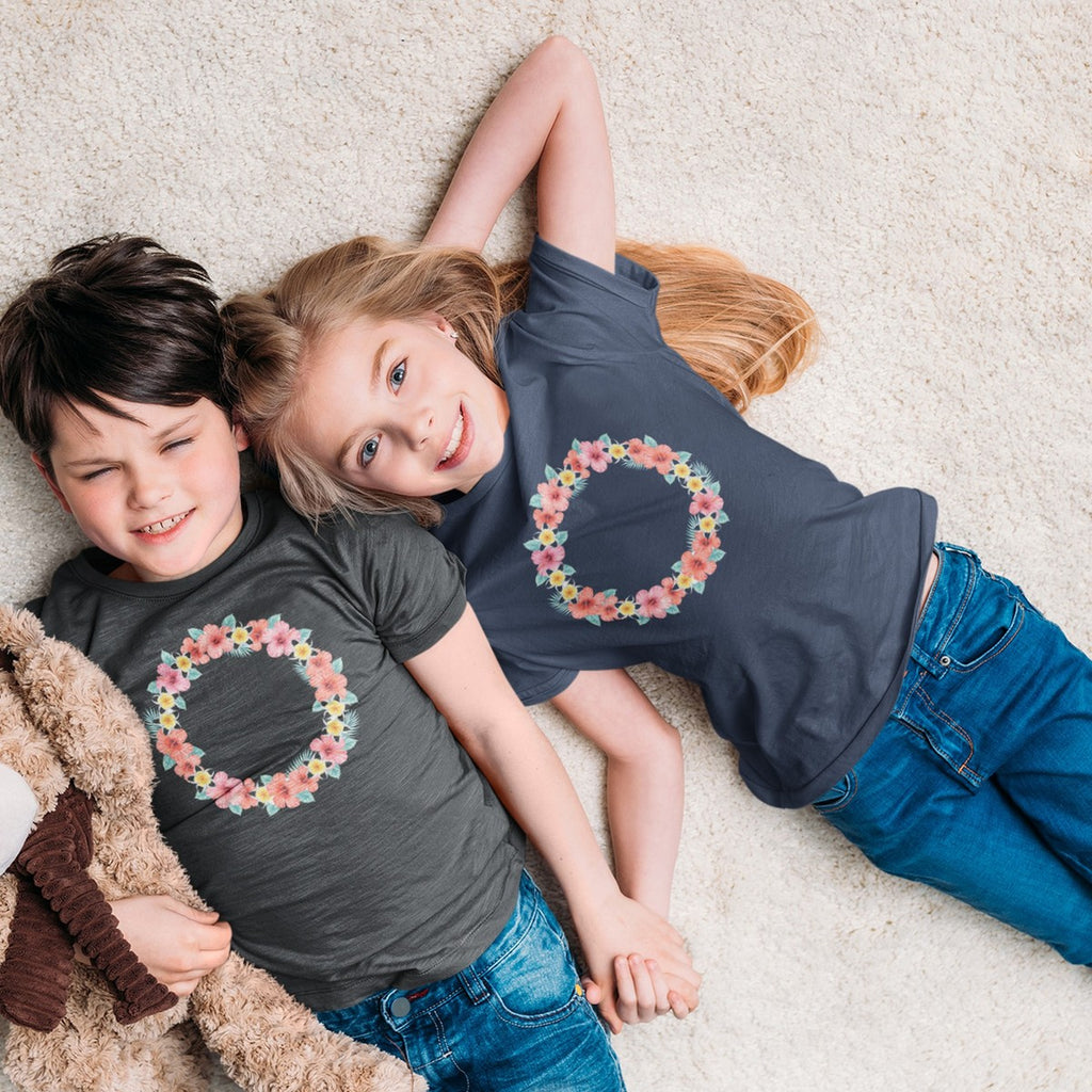 On-model lifestyle photo of the Hawaiian Flower Lei Wreath Hibiscus Plumeria Kids Hawaiian T-shirt