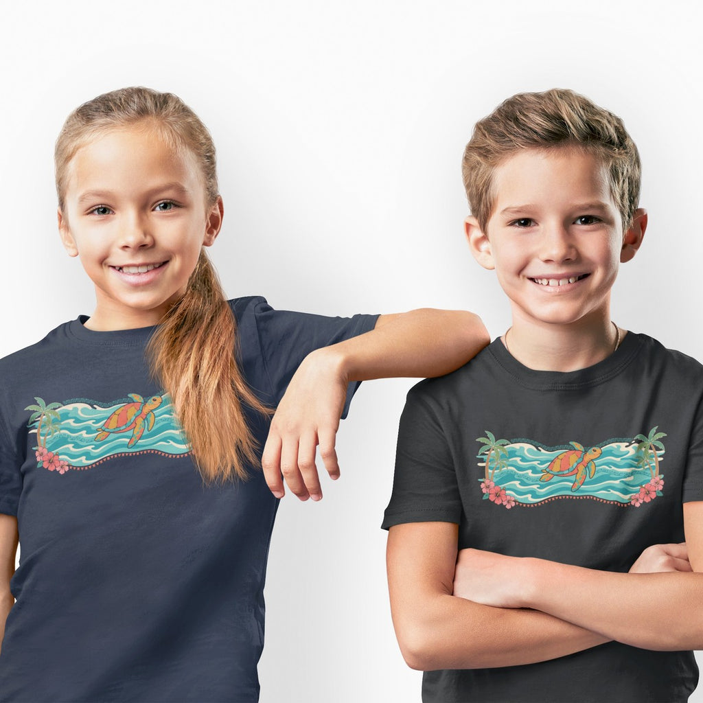 On-model lifestyle photo of the Hawaii Sea Turtle Island Paradise Tropical Scene Kids Hawaiian T-shirt