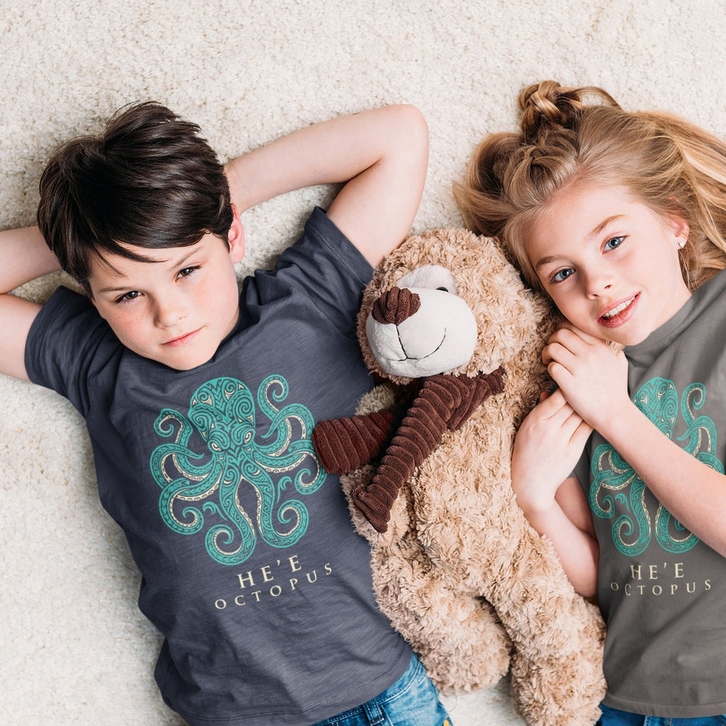 On-model lifestyle photo of the Hee Octopus Polynesian Tribal Hawaii Graphic Kids Hawaiian T-shirt