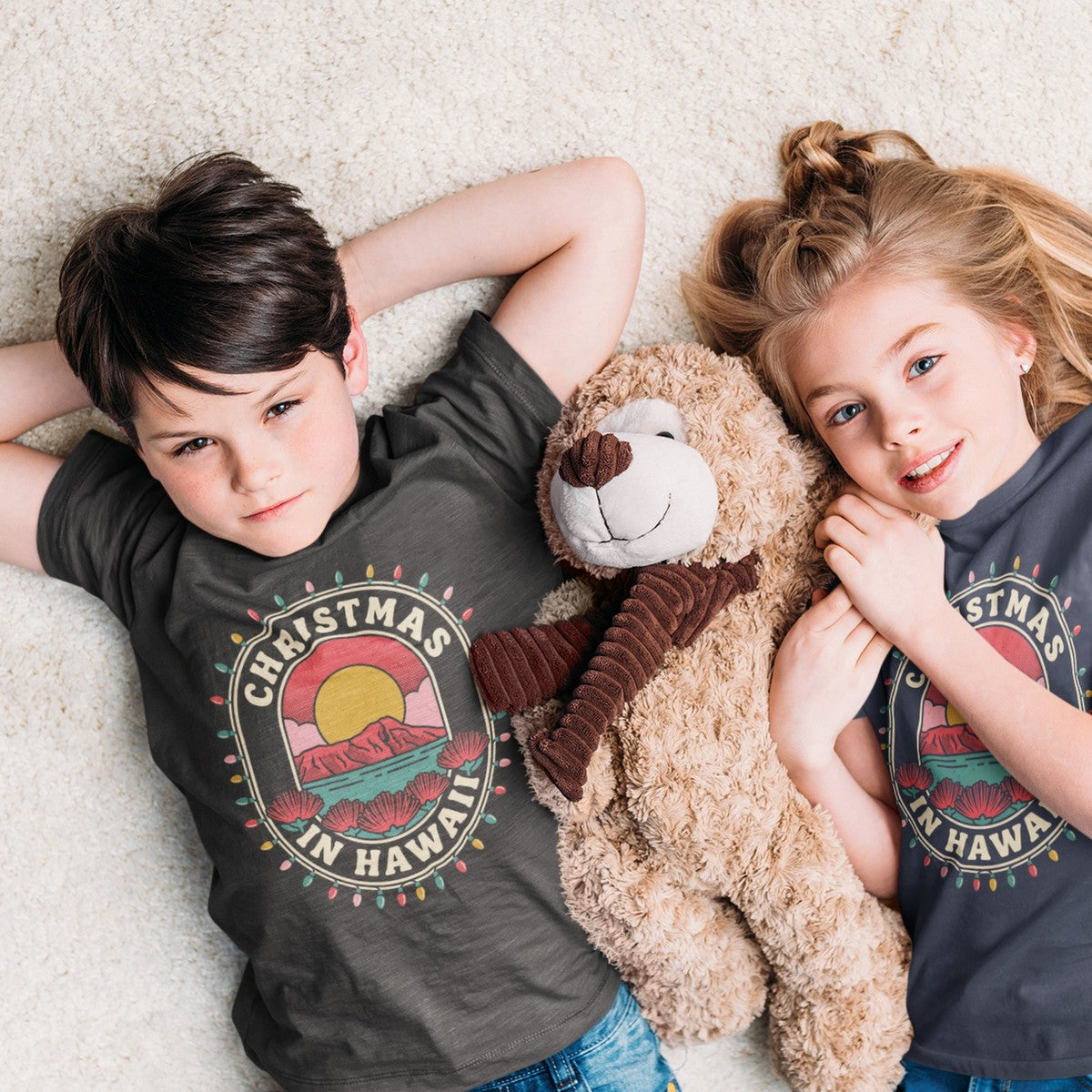 On-model lifestyle photo of the Hawaii Christmas Travel Badge Hawaiian Christmas Kids Hawaiian T-shirt