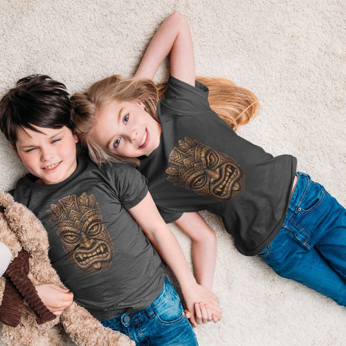 On-model lifestyle photo of the Carved Tiki Mask Hawaiian Tropical Graphic Kids Hawaiian T-shirt