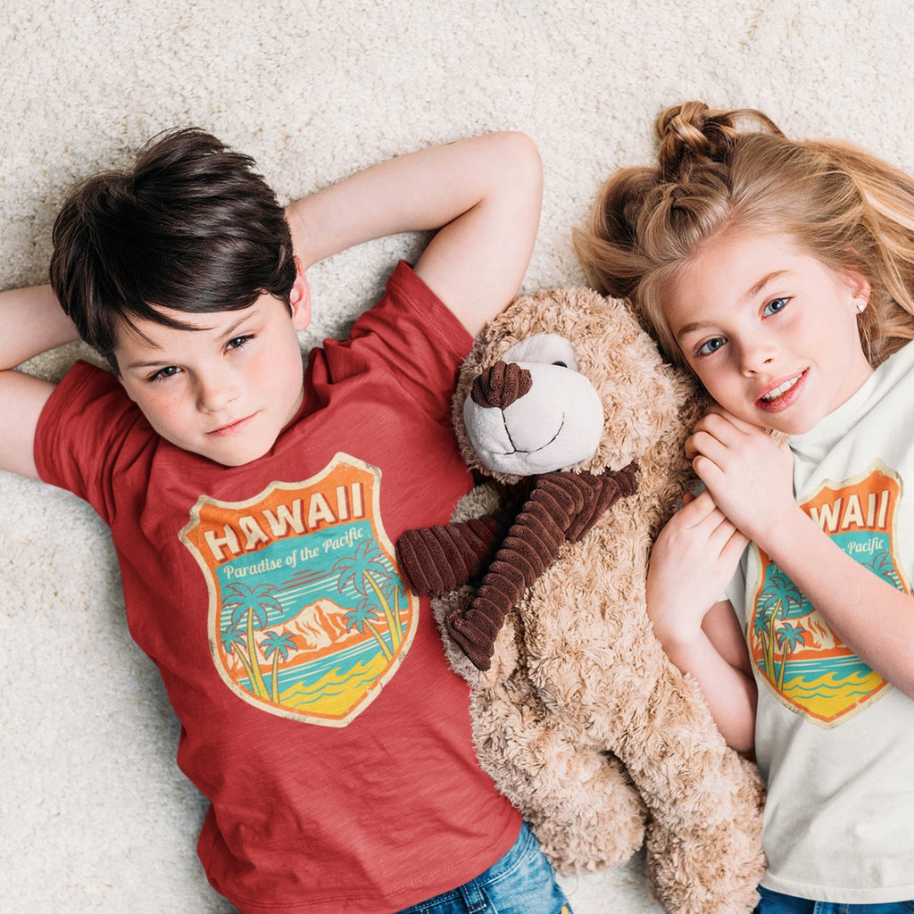 On-model lifestyle photo of the Hawaii Paradise of the Pacific Vintage Travel Kids Hawaiian T-shirt