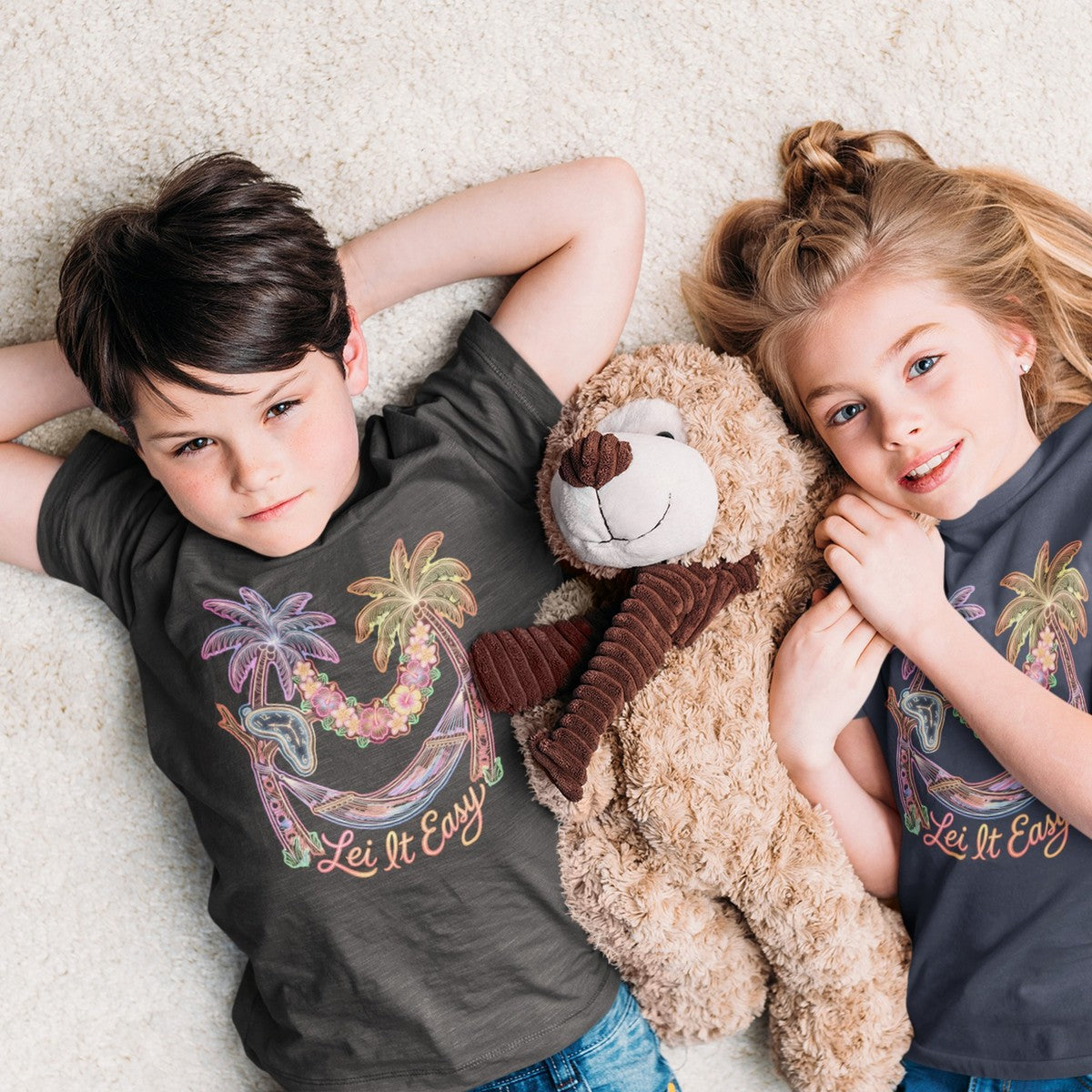 On-model lifestyle photo of the Lei It Easy Hawaii Hammock Beach Vibes Kids Hawaiian T-shirt