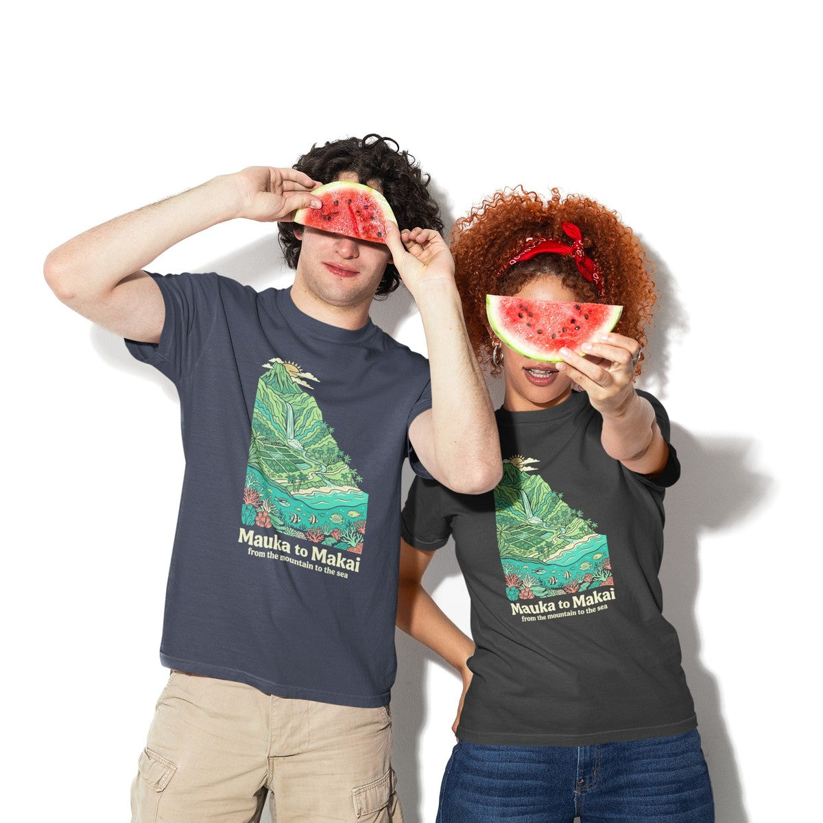On-model lifestyle photo of the Mauka to Makai Hawaii Mountain to Sea Graphic Hawaiian T-shirt